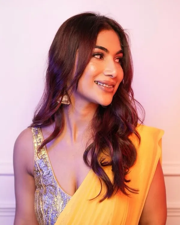 A beautiful showcase of a rich, red-toned balayage. The hair is styled in soft waves to catch the light and show off the seamless blend of colours, creating depth and dimension.