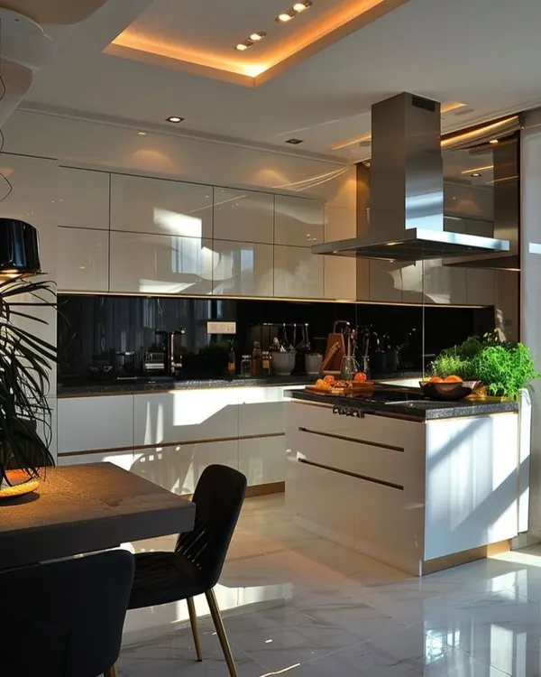 This kitchen features a large island with a built-in hob, making it a central hub for cooking and socializing. The open-plan layout connects the kitchen seamlessly with the dining area.