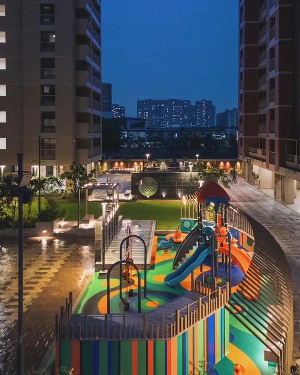 The "Pixelscapes" playground at dusk, where integrated lighting ensures the fun can continue safely after the sun goes down.