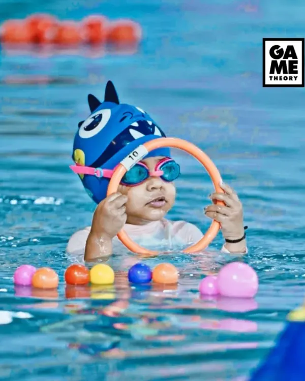 One ring at a time! Our toddler swimming program uses fun games and toys to get your little one comfortable and happy in the water.