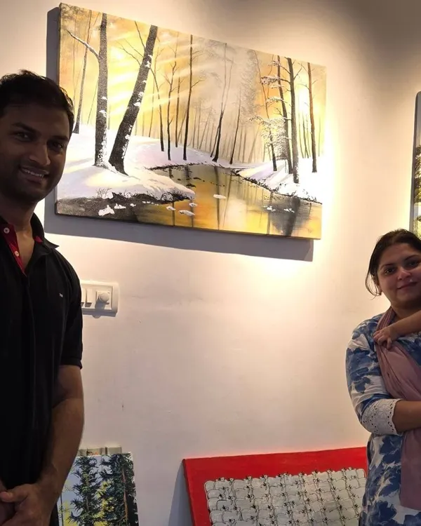 We love seeing our art find its perfect home. Here, a happy family poses with their new landscape painting, a beautiful piece that will bring joy and color to their space for years to come.