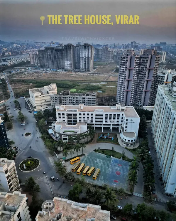 A clear aerial shot of the Tree House High School campus in Virar. This image is perfect for an institutional portfolio, showing the school building, playground, and surrounding neighborhood in a single, informative view.