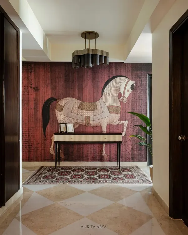This hand-illustrated horse mural, set against a deep maroon textured backdrop, was created to be the heart of an elegant entryway. The design blends traditional motifs with a modern sensibility, creating a piece of understated luxury that welcomes you home.