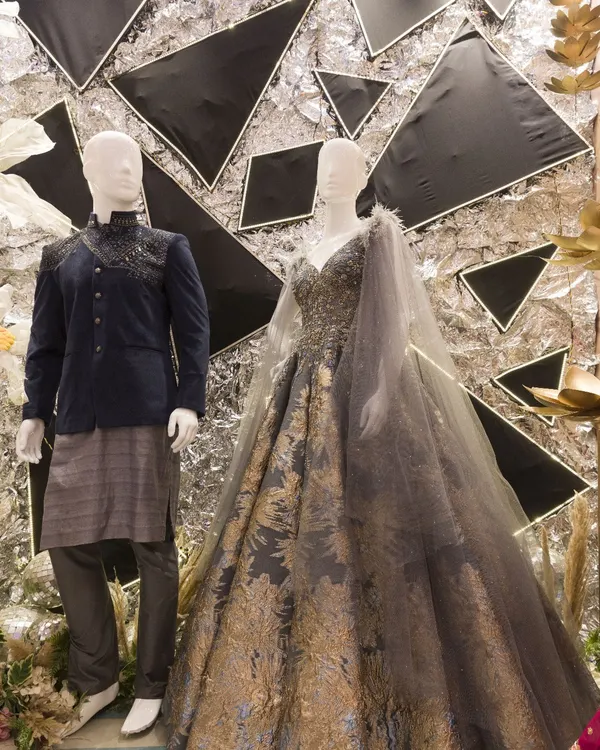 A showcase of our collaboration with bridal apparel brand Samyakk. This setup features a modern, edgy backdrop with mannequins dressed in a glamorous gown and a stylish bandhgala.