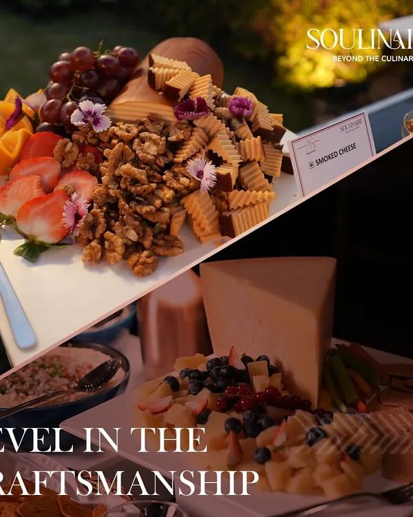Our grazing platters are a celebration of craftsmanship. This arrangement features smoked cheese paired with fresh strawberries, grapes, and walnuts, garnished with edible flowers for an elegant presentation.