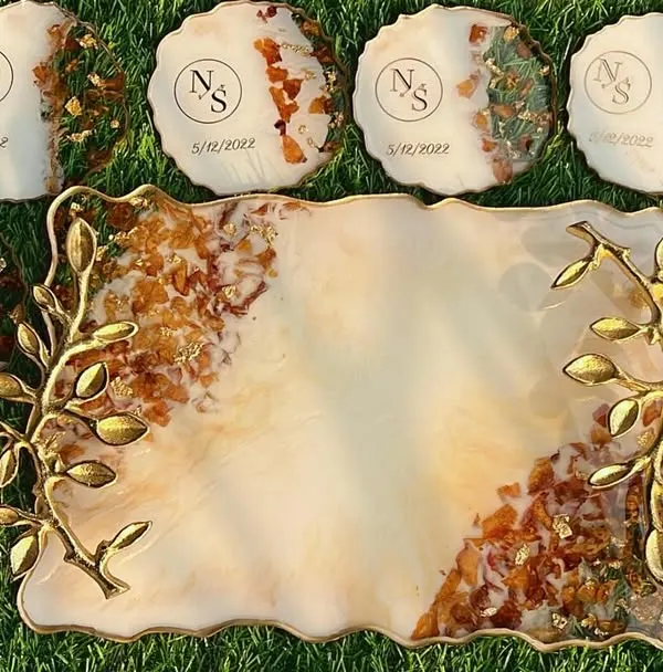 This is my specialty, turning your beautiful wedding varmalas into a timeless keepsake. This complete set includes a custom serving tray with elegant gold-leaf handles and eight matching coasters, all preserving the delicate flowers from your special day.