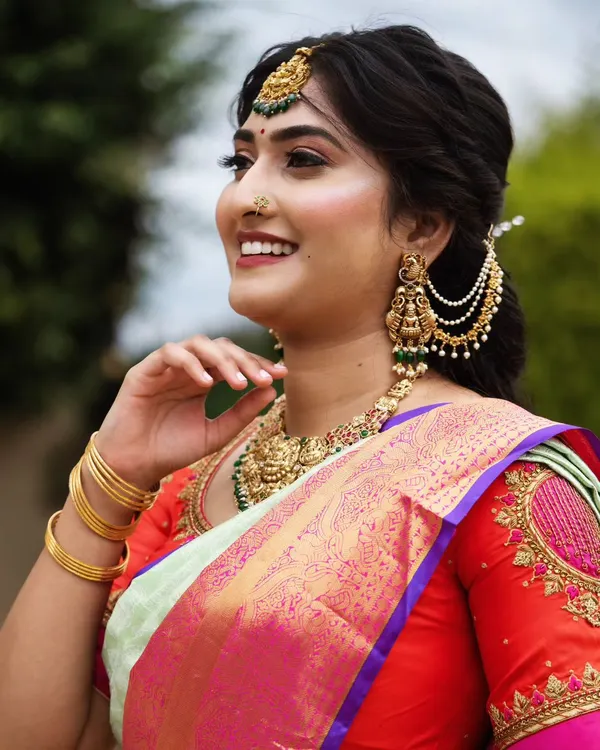 This close-up shows the detail of a flawless makeup application. Notice the smooth skin texture, the soft shimmer on the eyes, and the perfectly defined brows that frame the face.