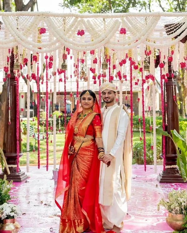 This is the heart of what I do: creating breathtaking traditional wedding mandaps. For this Sati Kalyana, I used classic carved wooden pillars and a canopy of fragrant jasmine and rose garlands to create a truly divine setting for the couple's sacred vows.