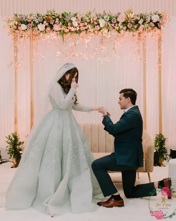A magical proposal moment during an engagement ceremony. I created a simple yet elegant backdrop with a floral-draped arch, allowing the couple's joy to be the main focus.