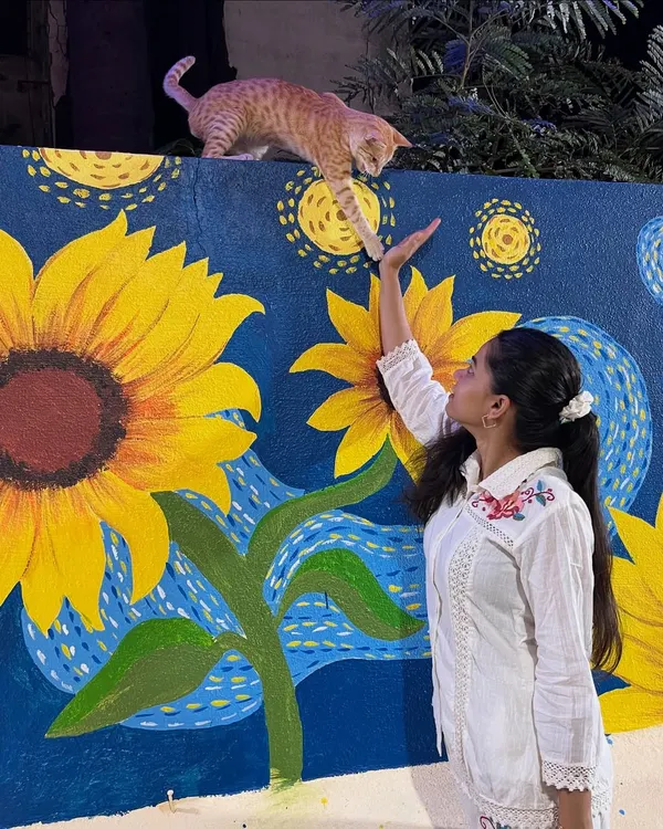 The completed 'Starry Night with Sunflowers' mural. This large-scale piece combines two of Van Gogh's most famous elements into one unique work of art.