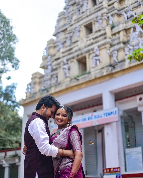 A romantic couple portrait taken at the iconic Bull Temple in Basavanagudi, Bangalore. This location adds a traditional and architectural element to pre-wedding photography.