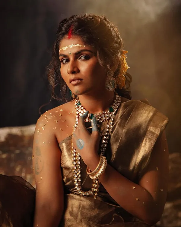 The opening shot from my conceptual series 'सुवर्ण कांता'. The styling uses a golden tissue saree, earthy makeup with touches of blue, and heavy jewelry to portray a powerful, goddess-like figure.