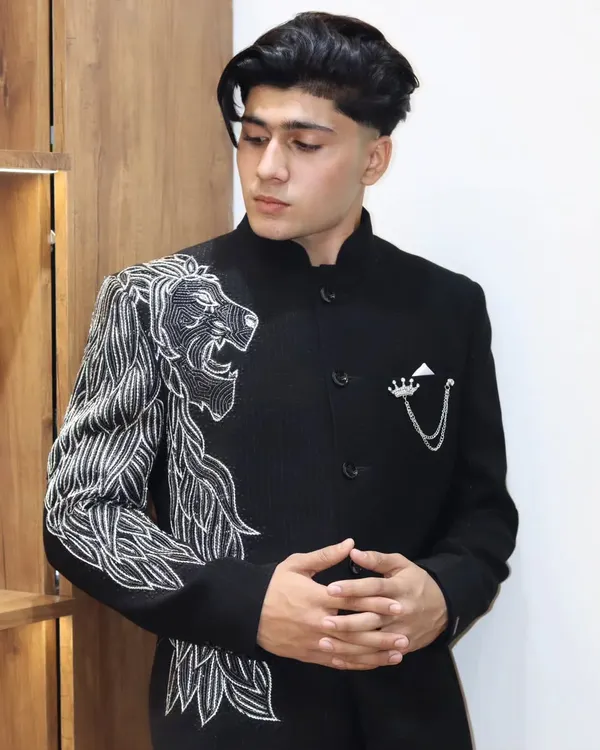 This is what I mean by a statement piece. A custom-made black bandhgala with intricate, hand-guided silver embroidery of a roaring lion. It's more than just an outfit; it's about wearing your confidence on your sleeve. This is the kind of detailed craftsmanship I bring to every garment.