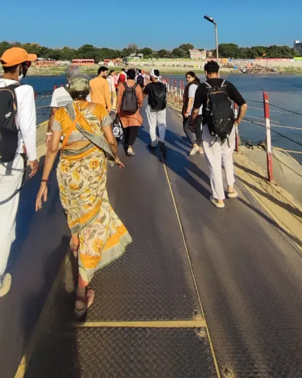 Walking with fellow seekers across a pontoon bridge towards the Sangam during the Kumbh Mela. We move as one body, a river of humanity flowing towards the confluence of sacred waters.