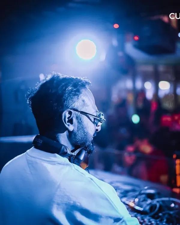A DJ looks out over the crowd from the booth at High Ultra Lounge. I produce regular club nights at Bangalore's most premium rooftop venue, featuring top-tier artists.