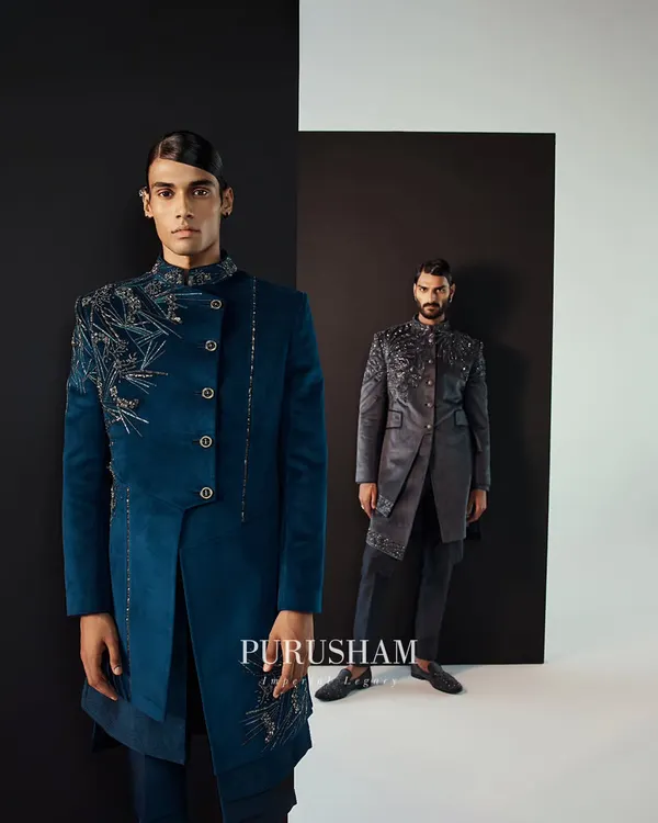 My Winter 23-24 collection is about sophistication in pure fabrics. Here, a teal velvet bandhgala with asymmetrical embroidery stands beside a grey version, both exuding a quiet, regal power.
