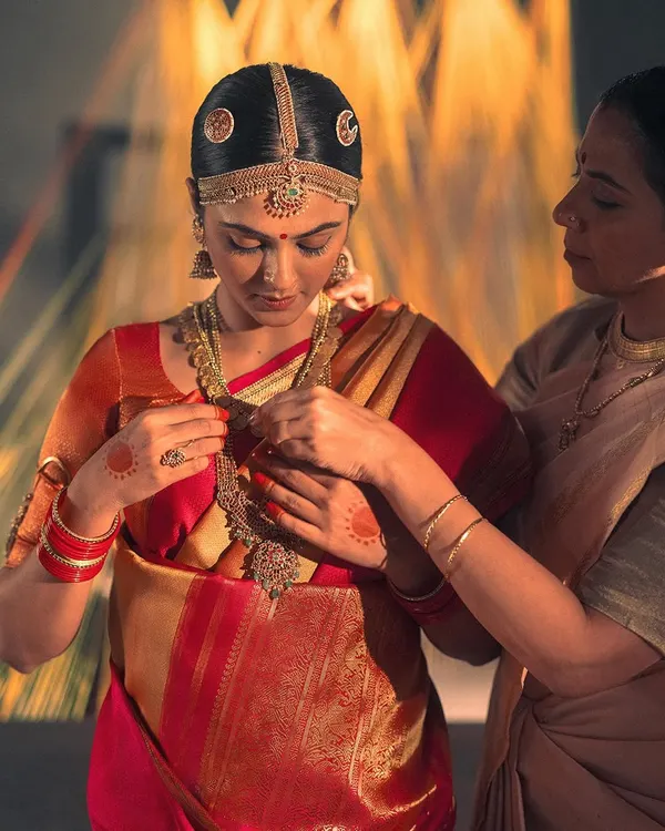A close-up on the bride from the Kanakavalli 'Little Rituals' campaign. The styling focused on authentic South Indian bridal adornment, from the temple jewelry to the intricate details on the Kanjivaram saree.