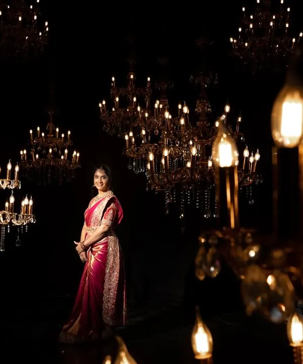 A bride surrounded by a galaxy of chandeliers. I wanted to create a portrait that was as magical and radiant as she is, using the lights to frame her in a sea of gold.