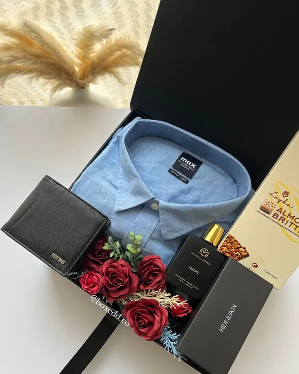 Even classic gifts for men like a shirt, wallet, and belt can be elevated when presented in a beautifully curated hamper like this one.