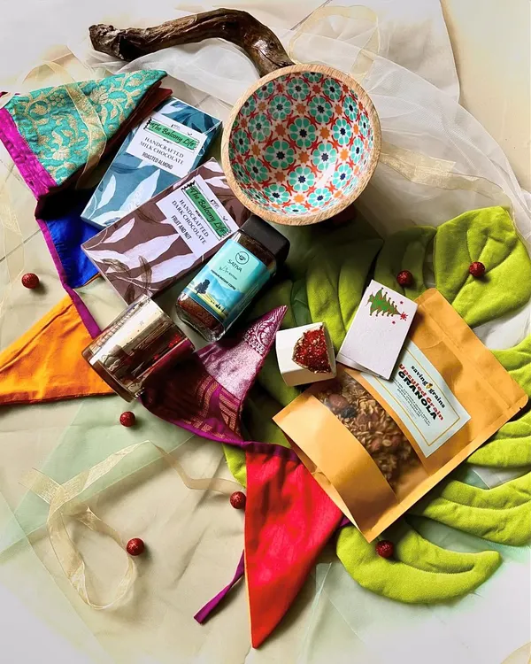 This is the hamper that started it all for a big corporate client. I wanted to create something that felt festive for Christmas but was also beautiful enough to be used for any celebration. We brought together handmade chocolates, premium coffee, a gorgeous mango wood bowl, and even upcycled fabric decor made by the amazing women of Samposhan. It’s a box full of stories and treats.