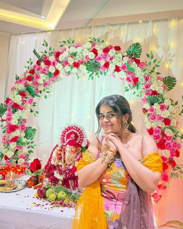 We loved creating this Ganesh Chaturthi backdrop for our client. The floral arch of pink and white roses perfectly frames the idol and brings so much joy to the home celebration.