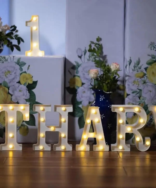 Make your event unique with personalized marquee letters. These light-up letters spelling "ATHARV" were part of a blue Moroccan theme, adding a beautiful, warm glow to the decor.