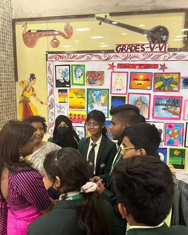 I love interacting with students during art exhibitions. Here I am at the AECS Magnolia Maruti Public School, discussing the artworks with the talented young artists who created them.