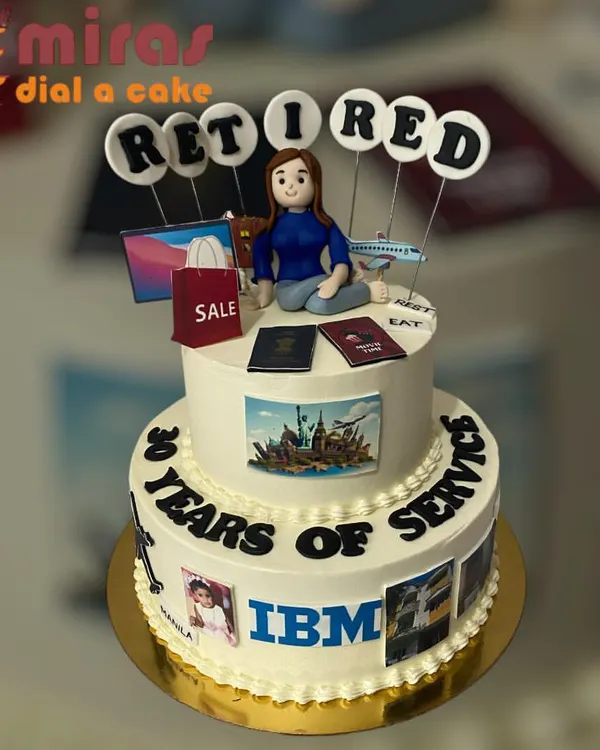 This two-tier cake was designed to celebrate 30 years of dedicated service at IBM. I incorporated personal photos and details about the retiree's future plans, like travel and shopping, to create a truly meaningful farewell centerpiece.