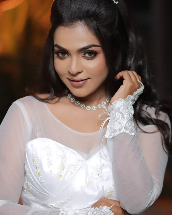A signature celebrity-inspired look for a Christian wedding. The makeup is elegant and enhances her natural beauty, with soft eyes and a neutral lip, perfect for a white gown.