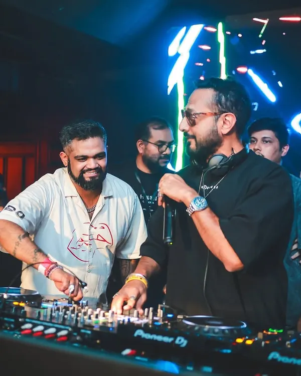 Going back-to-back with the legendary Nikhil Chinapa. In this shot, we're syncing up, sharing a laugh, and getting ready to drop the next track for an electric crowd at Opa Bar.