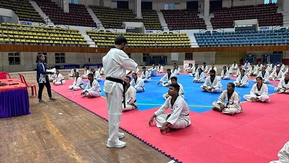 Addressing a large group of participants at the start of a National Kyorugi Referee Seminar in Cuttack, Odisha. My goal is to impart knowledge and instill a deep respect for the rules of Taekwondo.