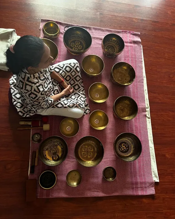This is my sanctuary of sound. I use a collection of Tibetan singing bowls, each with a unique frequency, to create an immersive sound bath. This practice is a profound experience of rest and healing, helping you connect with the silence within.
