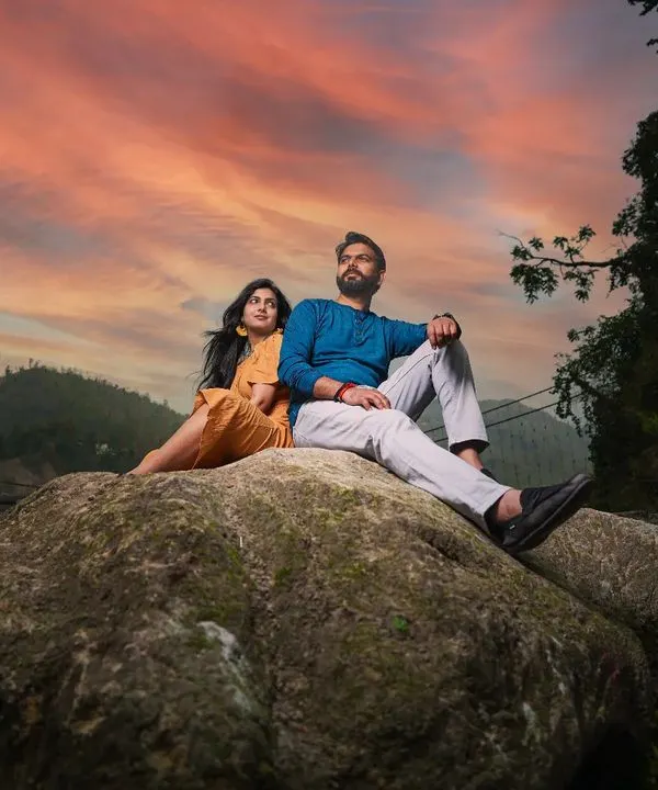 We found this spot in Rishikesh just as the sun was setting, painting the sky with orange and pink hues. It created a breathtaking, romantic backdrop for this portrait, capturing the couple against the vastness of nature.