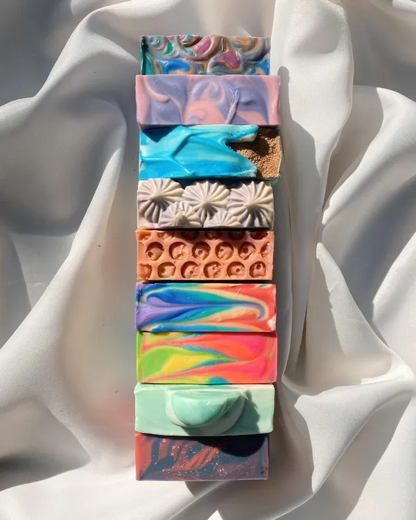 A stack of my beautiful, handcrafted soaps from our first collection of 2023. Each one tells a different story with its colors and patterns.