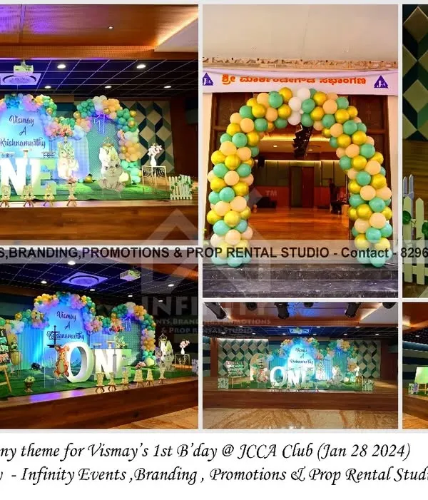 A cheerful bunny theme for Vismay's first birthday at JCCA Club. The setup includes a full balloon arch entrance, a custom stage backdrop, and a personalized milestone board with adorable bunny illustrations.