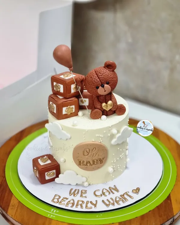 "We can bearly wait!" This adorable teddy bear cake is a favorite for baby showers. It features a hand-sculpted fondant bear, tiny blocks, and a sweet message for the parents-to-be.