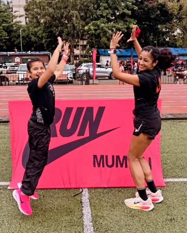 High-fiving my daughter at a Nike Run event. Every time a mom pursues her passion, her child learns the power of possibility. Homes thrive when moms are strong.
