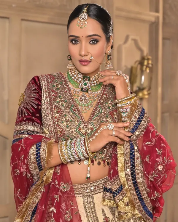 A regal bridal portrait. The makeup features rich tones on the eyes, a flawlessly sculpted base, and a velvety lip color, creating a look of pure elegance and grace.