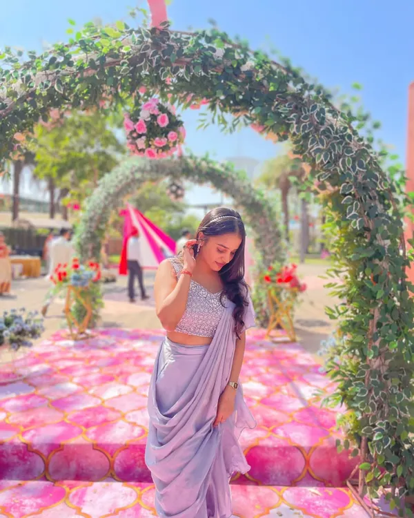 This lavender ready-to-wear saree looks stunning against a beautiful floral backdrop. It’s the perfect rental for a daytime wedding or garden party, offering elegance without effort.