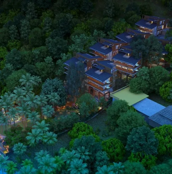 This aerial view captures the essence of the Atmanya resort in Goa, where individual villas are nestled within dense tropical foliage along the river, offering guests both privacy and a deep connection to nature.