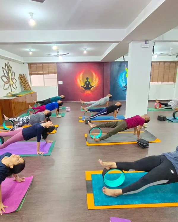 A full class using yoga wheels to deepen their backbends in unison. Props allow everyone to access poses safely and effectively.