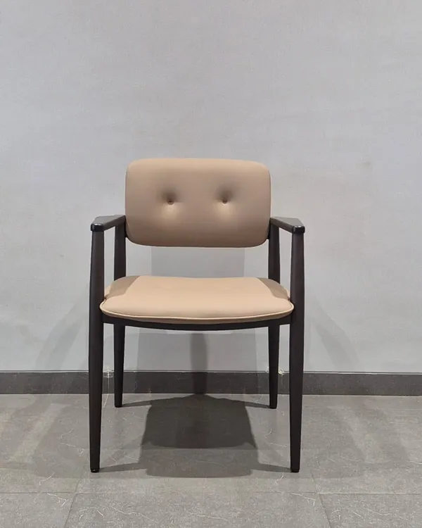 A new arrival. This is a simple yet elegant wooden chair with a button-tufted backrest, suitable for dining or as an accent chair.
