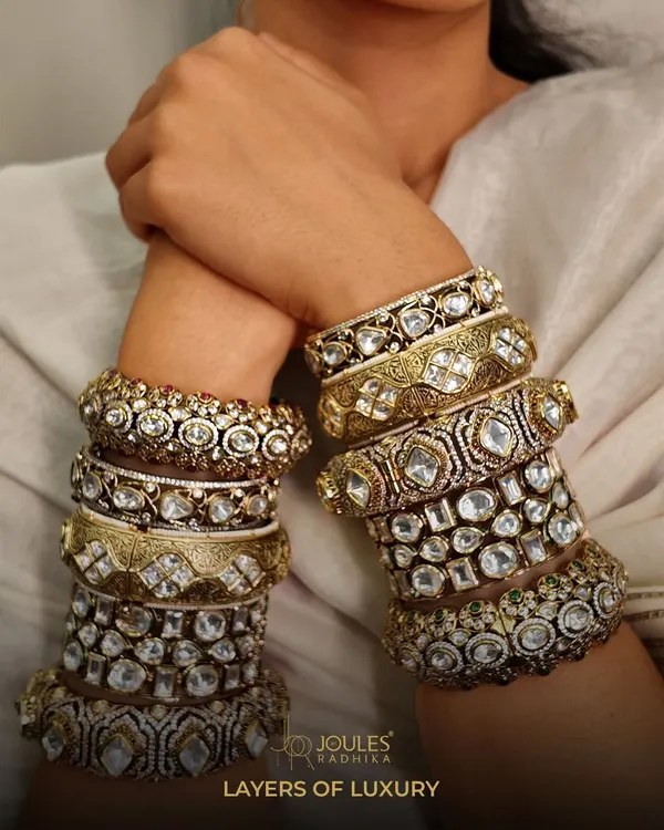 Layers of luxury for your wrist. A curated stack of wide polki and kundan kadas, showcasing different patterns and sizes for a truly opulent bridal look.