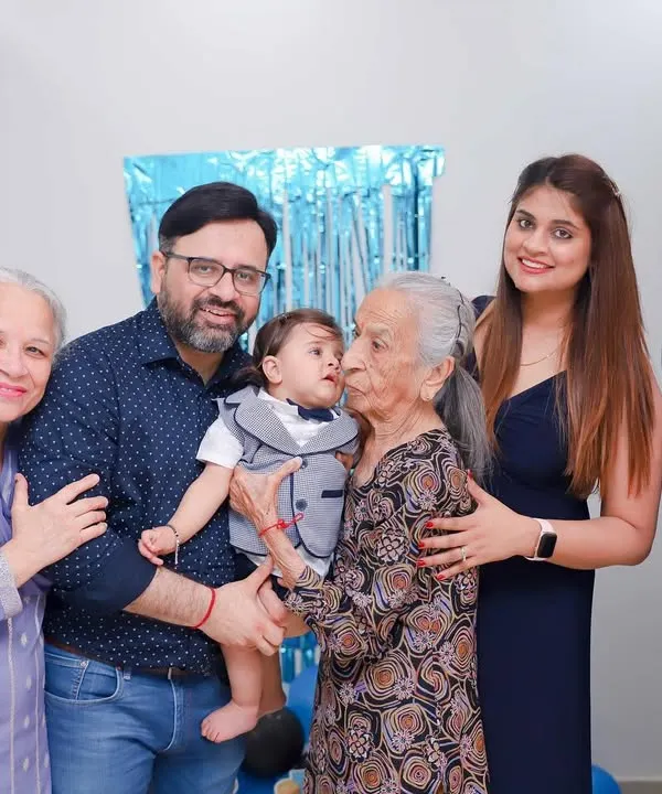 Four generations in one photo. A great-grandmother's kiss is a priceless memory we were honored to capture for this family.