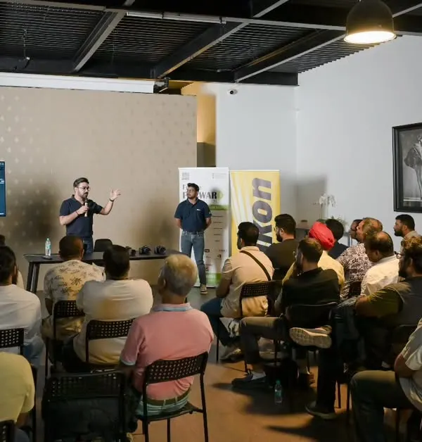 During a workshop with Nikon, I'm explaining a lighting concept on screen. I make sure to break down complex topics step by step, ensuring everyone in the room, regardless of their skill level, can follow along and learn.