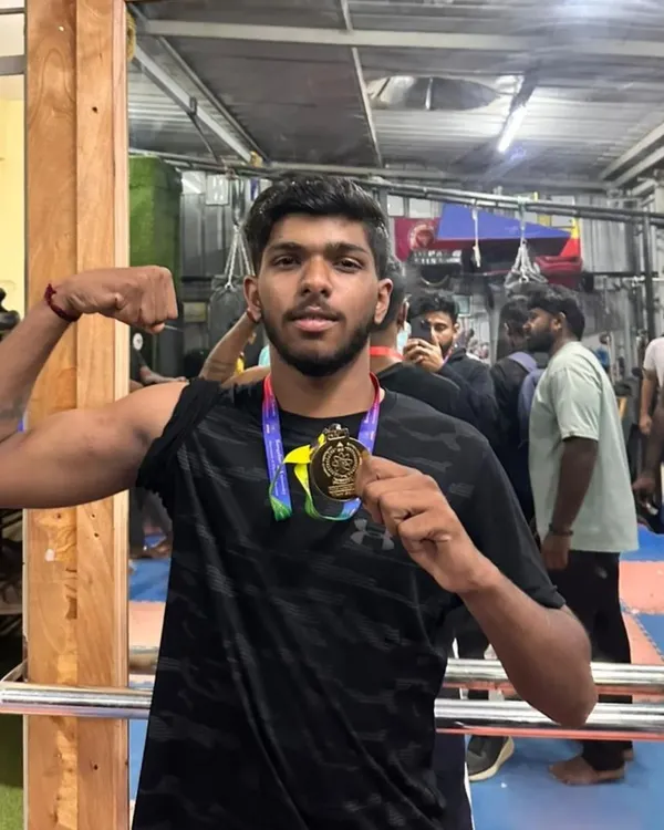 One of our boxers showing off his hard earned gold medal from the 2024 Bengaluru University Inter-college sports competition. The flex is well deserved.