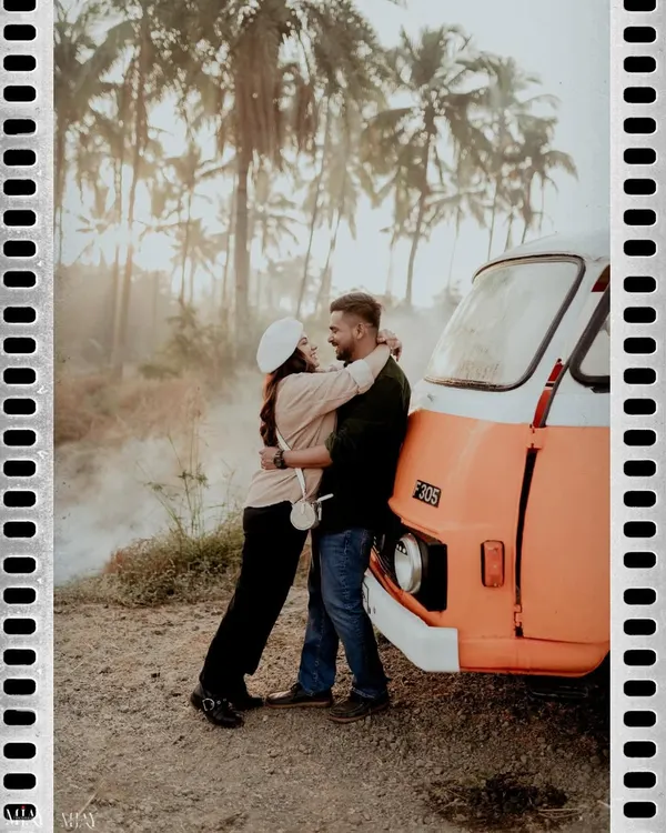 A romantic embrace against a vintage camper van. This shot perfectly captures the adventurous, free-spirited vibe of a road trip-themed pre-wedding shoot.