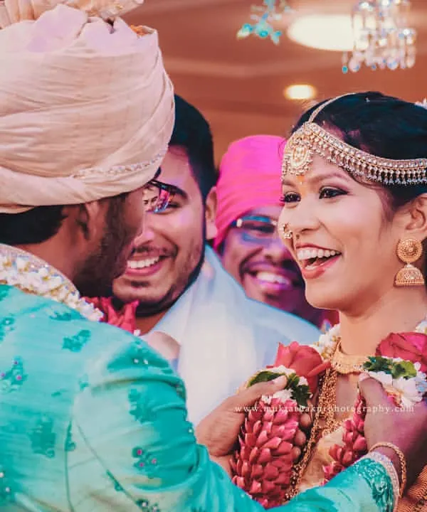 This is the moment I live for. The pure, unscripted joy during a South Indian wedding ceremony as the couple shares a laugh, surrounded by the happy faces of their loved ones.
