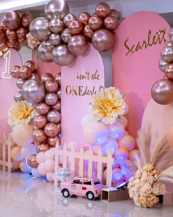 A "ONEderful" celebration for a little princess. This setup in shades of pink with metallic rose gold balloons, pampas grass, and a custom neon sign creates a glamorous and sweet first birthday party.