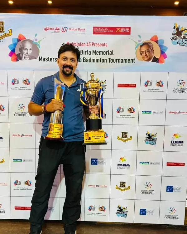 A great thrill to win a double crown at the GD Birla Interclub Badminton Tournament at Bombay Gymkhana, holding trophies for the Men's Doubles 45+ and Men's Doubles 85+ categories.